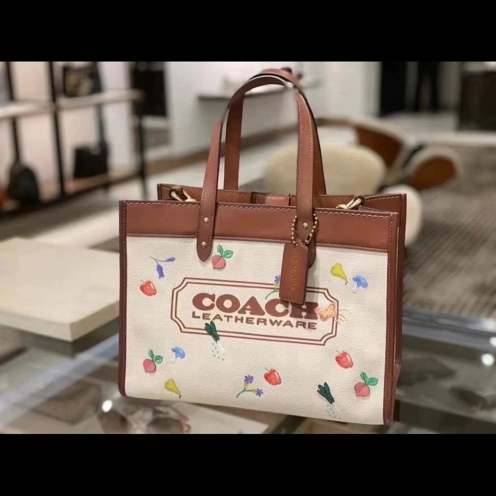 COACH
Field Tote With All Over Garden Embroidered Coach Badge